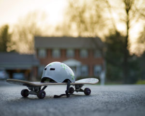 Skateboard and helmet in suburban neighbourhood